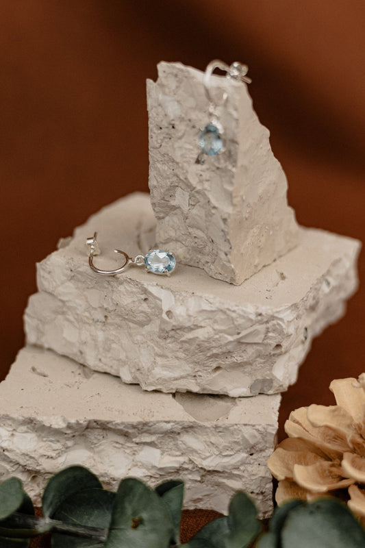 Blue Topaz Oval Drop Earrings on Silver Hoops